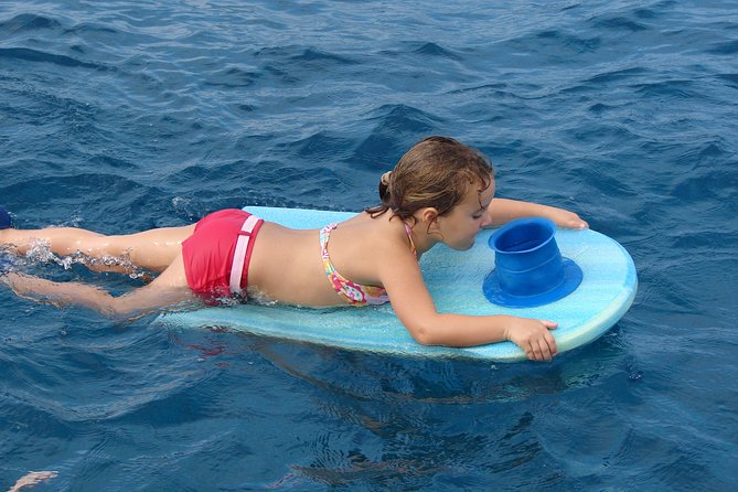 Deluxe Snorkel & Dolphin Watch Aboard a Luxury Catamaran from Kailua-Kona - How the price works at $183.77