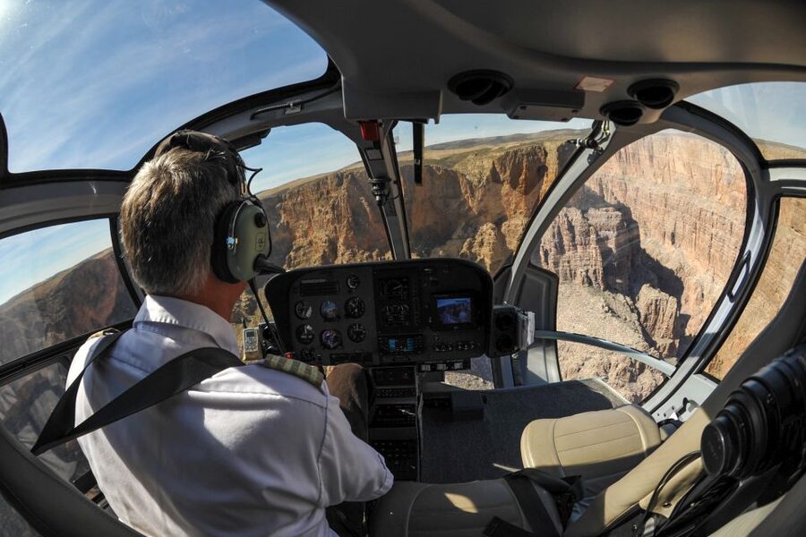 From South Rim: Grand Canyon Spirit Helicopter Tour - Crossing the Kaibab Forest before the canyon appears
