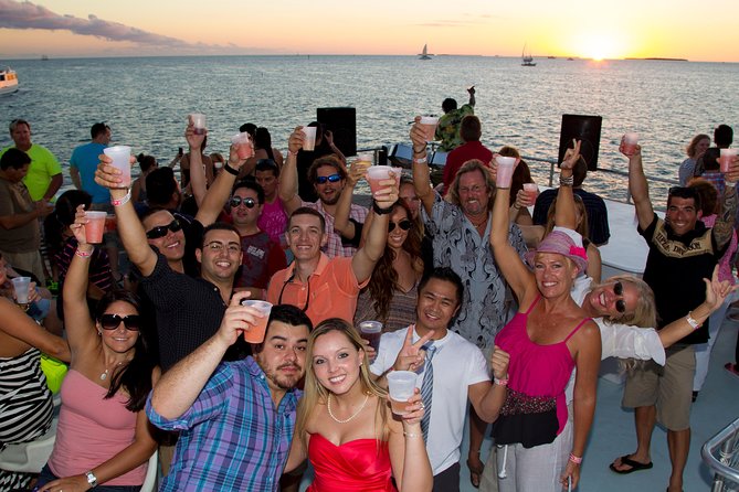 Key West Sunset Cruise: Dinner, Live Music & Drinks Included - Watching sunset from the upper deck