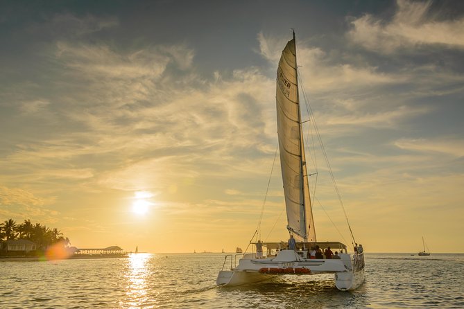 Key West Sunset Sail: Dolphin Watching, Wine, and Tapas - Sunset Key and the evening toast