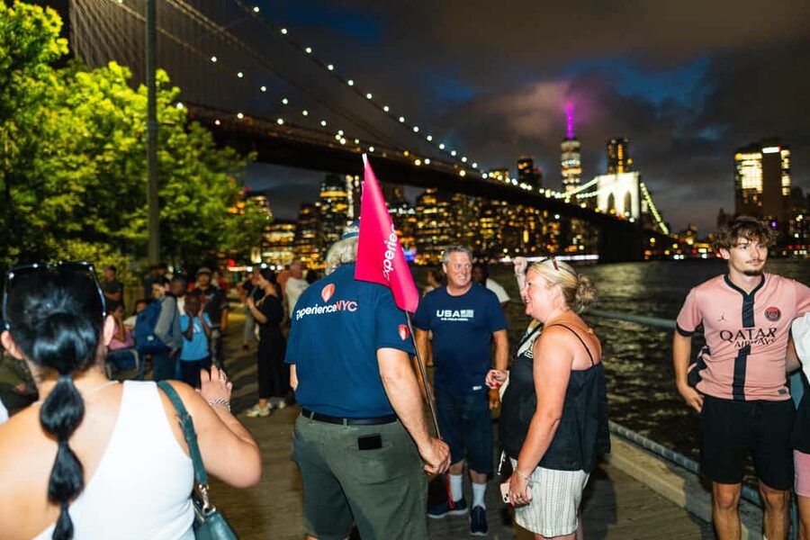 NYC at Night: 3-Hour Luxury Bus Tour of Top Highlights - Wall Street and One World Trade Center after sunset